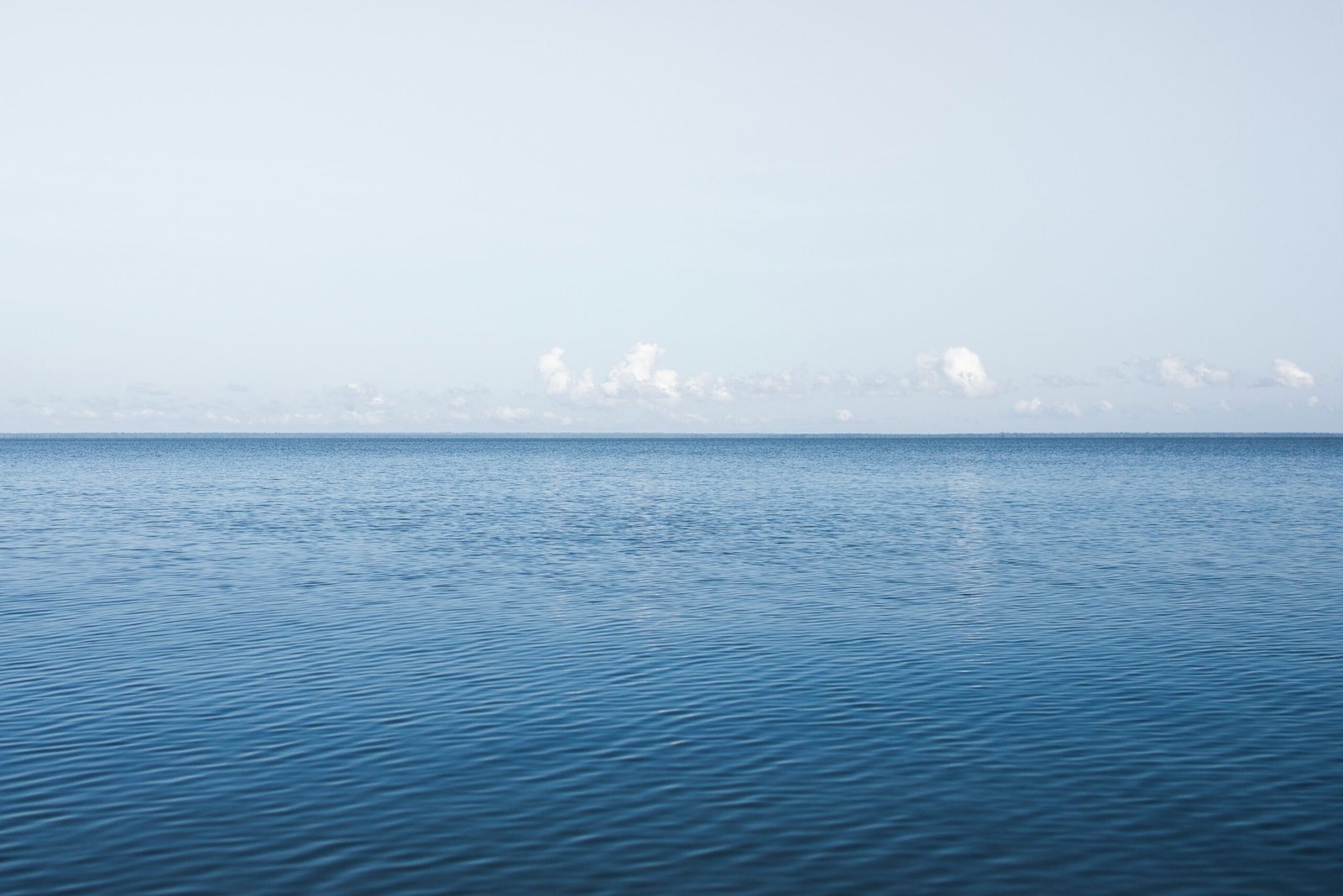 blue sea under blue sky during daytime